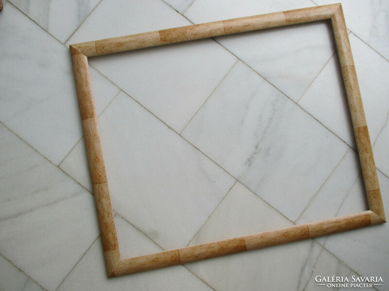 Large wooden photo frames with a bamboo effect are in new, structurally stable condition