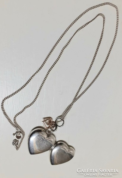 Marked silver necklace with silver cariad opening heart and soldered gold heart pendant