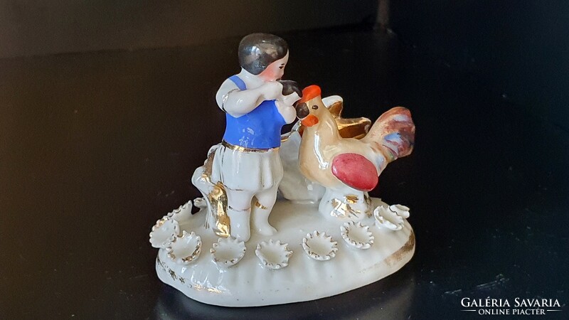 Antique mini German porcelain little girl with cock. Injured. 6 cm high.