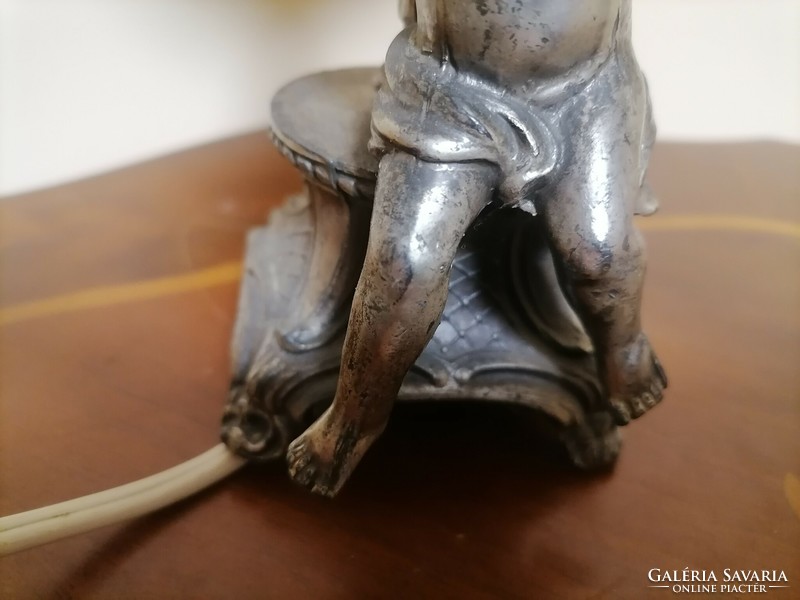 Antique pewter lamp with putto