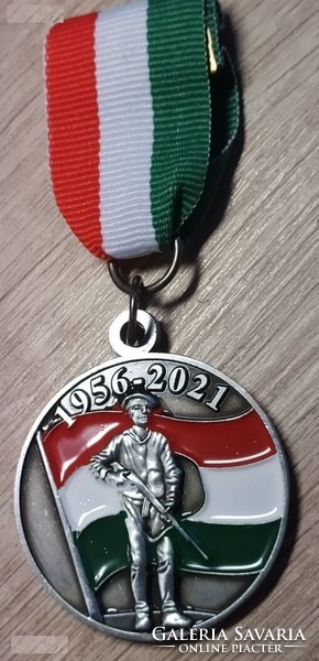 The commemorative medal is silver. 1956-Os 65 years v445