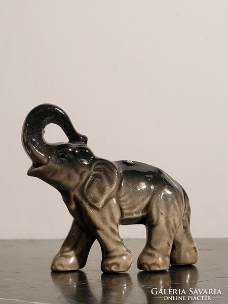 Porcelain elephant with an upward pointing trunk 9x8cm