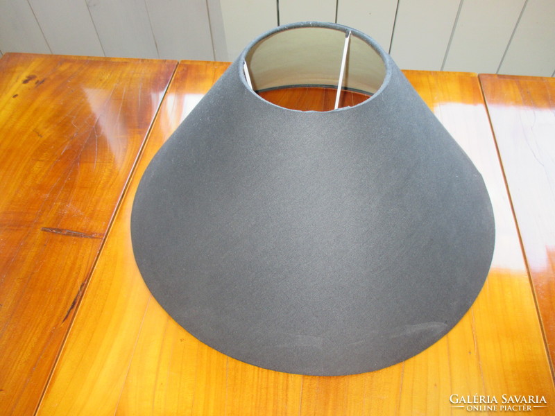 Black, bone-colored inside, table lamp shade that directs the light flawlessly