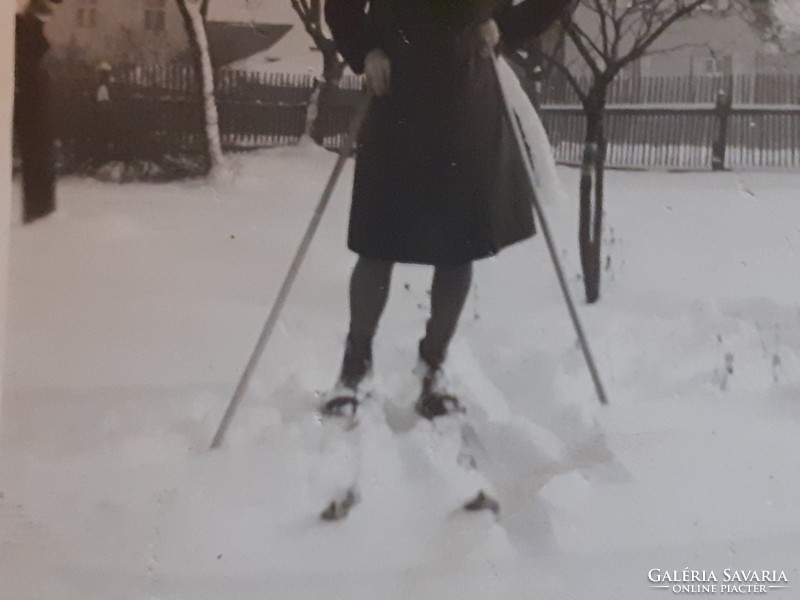 Old female photo circa 1940 with vintage winter photo skis