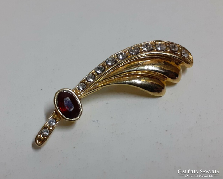 Old high-quality gold-plated brooch in beautiful condition, decorated with burgundy and small shiny stones