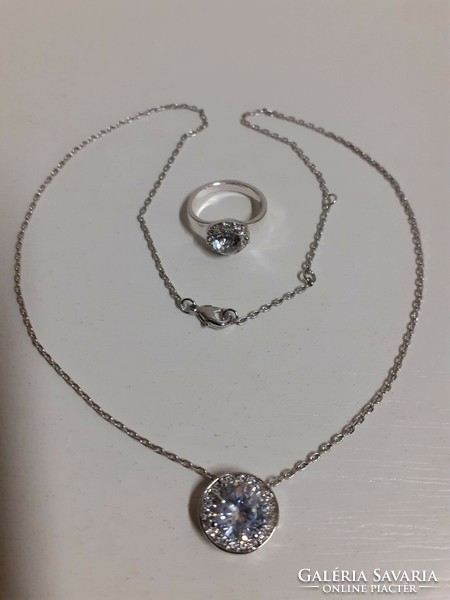 A noble steel necklace with a pendant ring studded with polished, shiny large stones