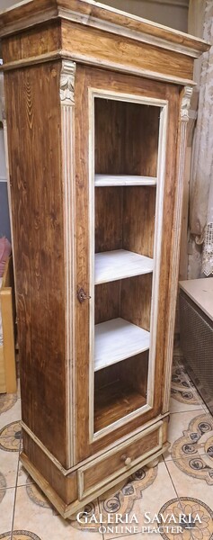 Narrow storage cabinet with Old German books