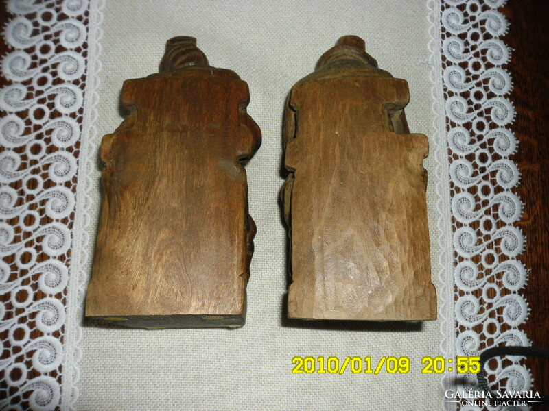 Pair of hand-carved elderly statues