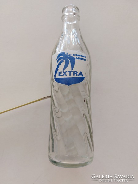 Retro glass bottle of extra carbonated soft drink with inscription