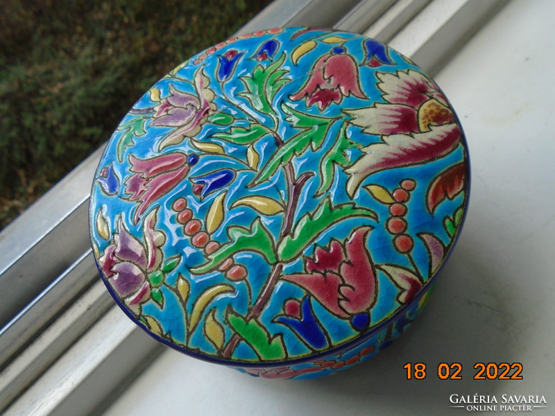 Antique longwy majolica bonbonier embossed with colorful enamel patterns on a turquoise background