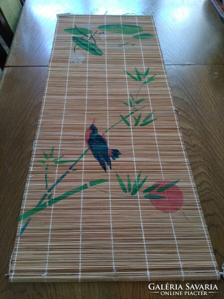 Old hand-tied and painted bamboo or reed table runner with painted bird decoration