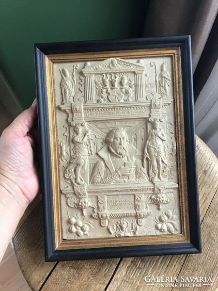 A framed picture made of older special cast material, with the stamp of the wagnermuseum