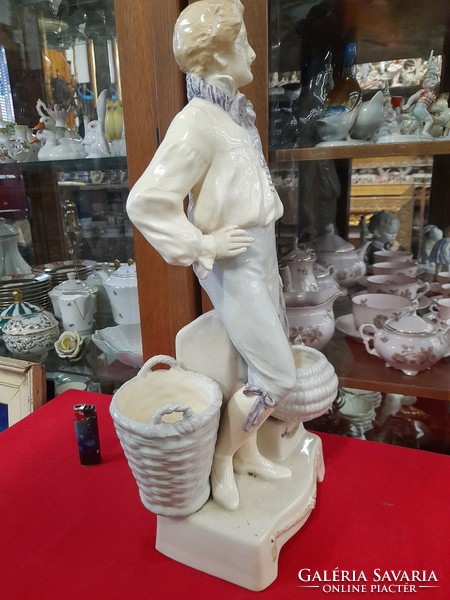 End of the 19th century Austria, porcelain figure of a boy with a basket in the Podany style, statue, portrait. 48 Cm.
