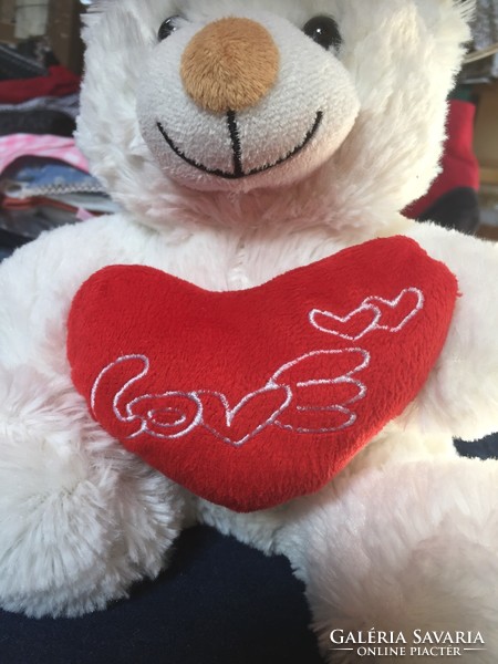 A very soft, lavender-scented teddy bear with a heart with the inscription love