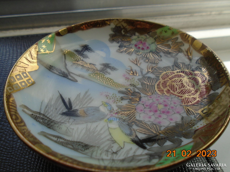 Antique hand-painted, gold-contoured eggshell porcelain Japanese bowl with a pair of birds and a flower pattern