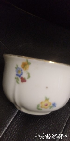 Thick antique cup with scattered flowers