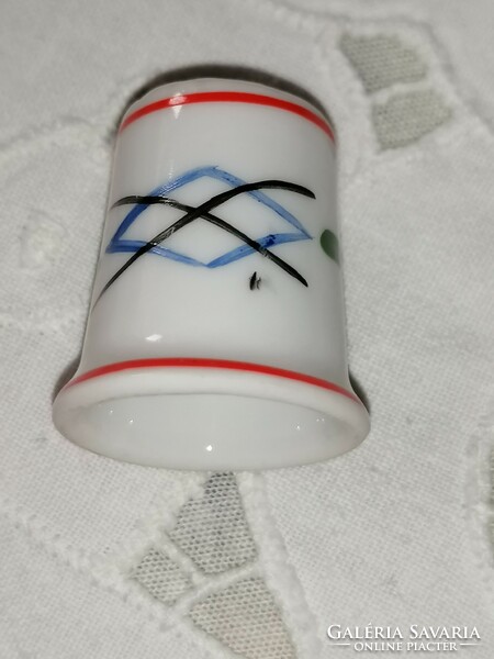 Porcelain thimble with Raven House marking 27.