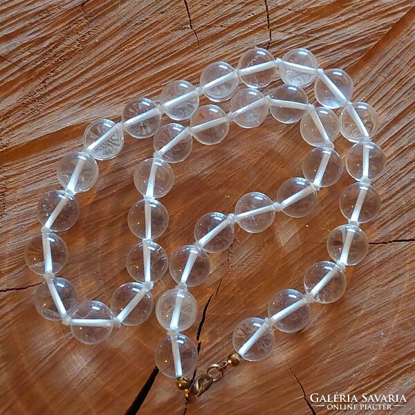 A beautiful big-eyed rock crystal necklace with knotted lacing