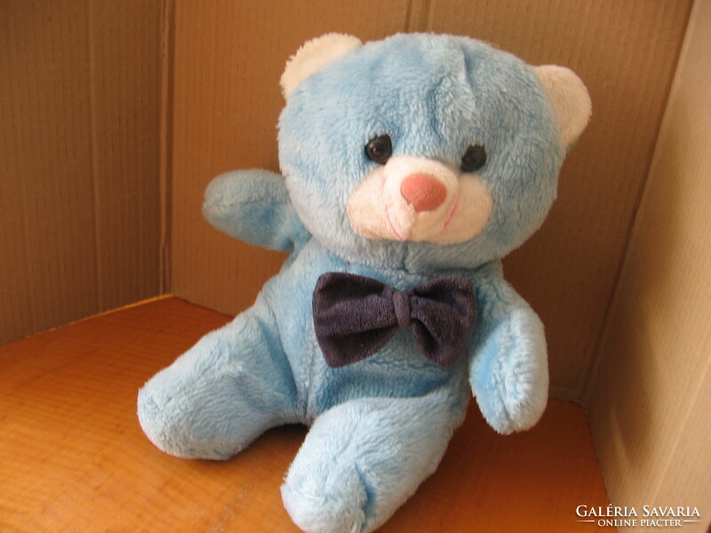 Retro blue sitting teddy bear