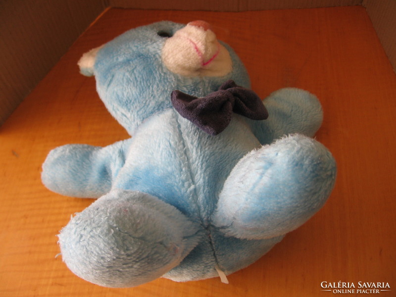 Retro blue sitting teddy bear