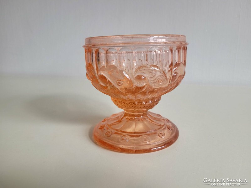 Old glass goblet with pink base