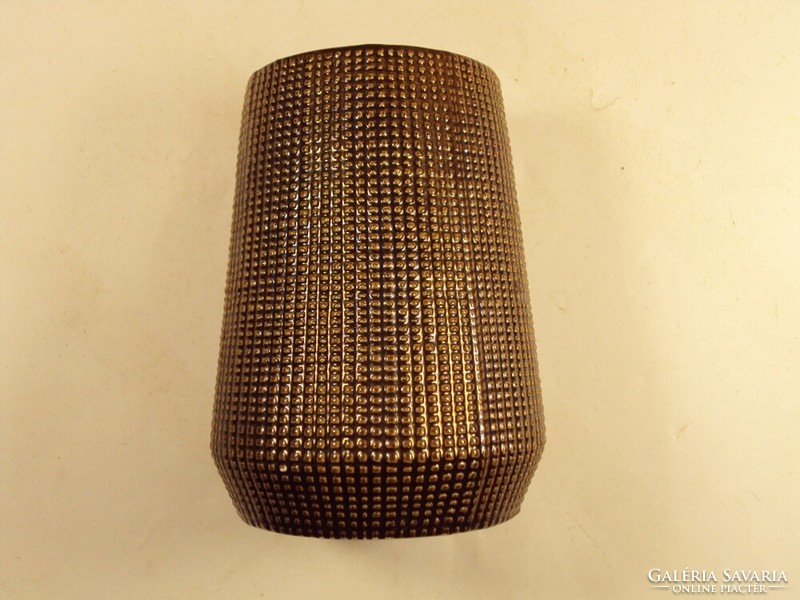 Old retro ceramic vase with a grungy pattern