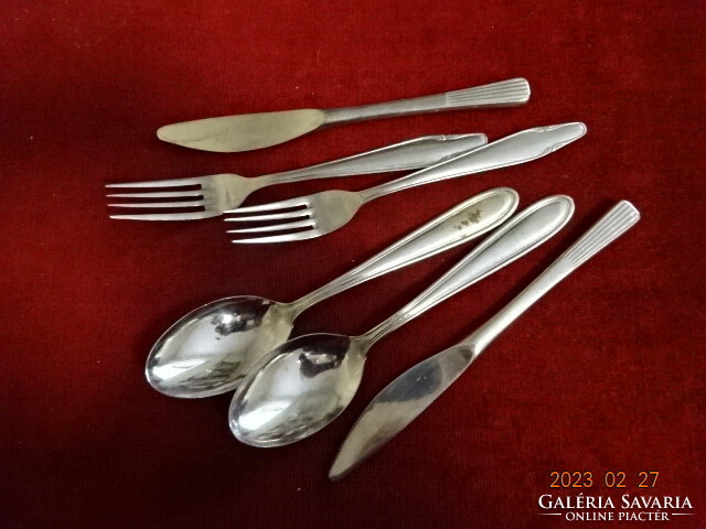 Chrome cutlery, two forks, two spoons, two knives. Not the same brand. Jokai.