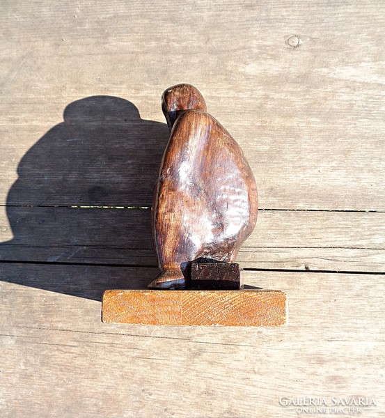 Seated woman, wooden sculpture