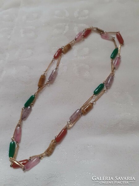 Necklace combined with retro gold-colored metal and plastic beads