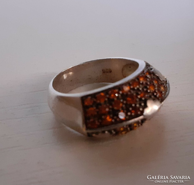 Nice condition hallmarked 925 silver ring set with sparkling tiny orange cubic zirconia stones