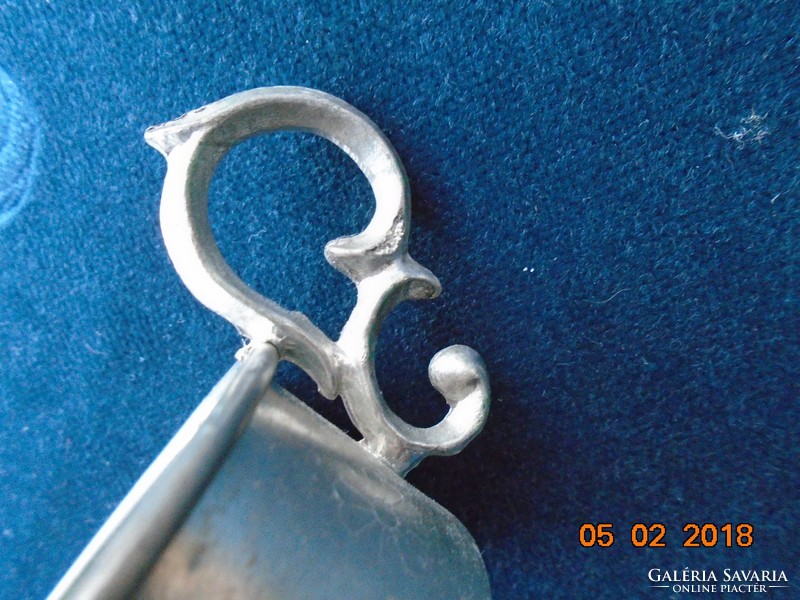 Pewter cup holder with decorative tongs with a chiseled floral pattern