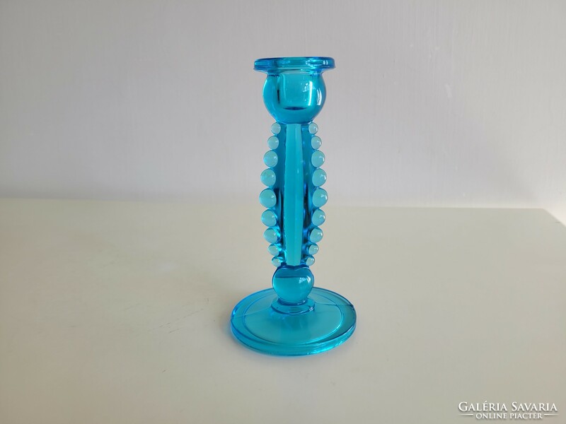 Old blue glass candle holder with beaded glass decoration