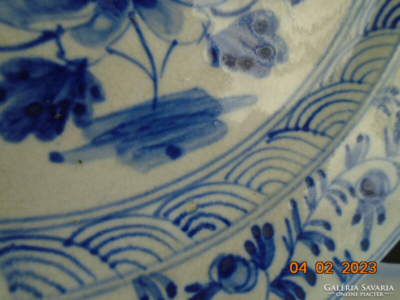 An early Ming Chinese plate with a floral pattern, hand-painted with cobalt blue under an antique glaze