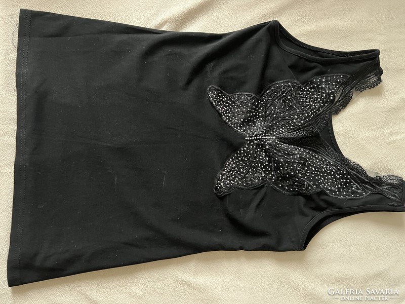 Sleeveless black casual top with glitter butterfly pattern