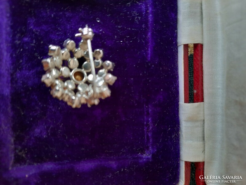 Beautiful brooch decorated with sparkling stones