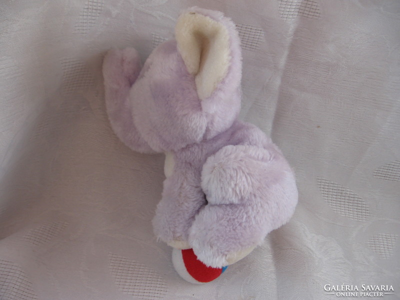 Purple plush elephant with a ball