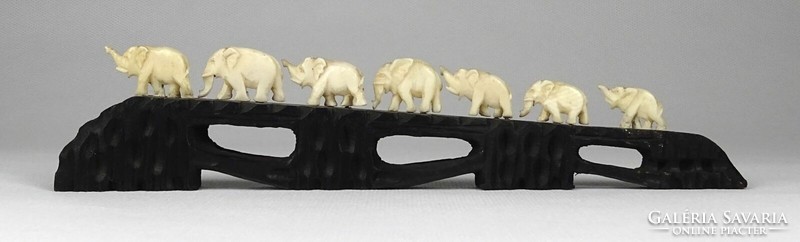 1L984 carved bone marching herd of elephants 22 cm