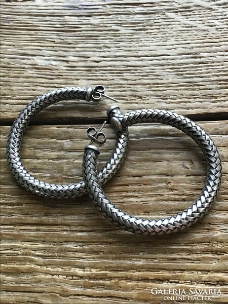 Old silver earrings with braided decoration