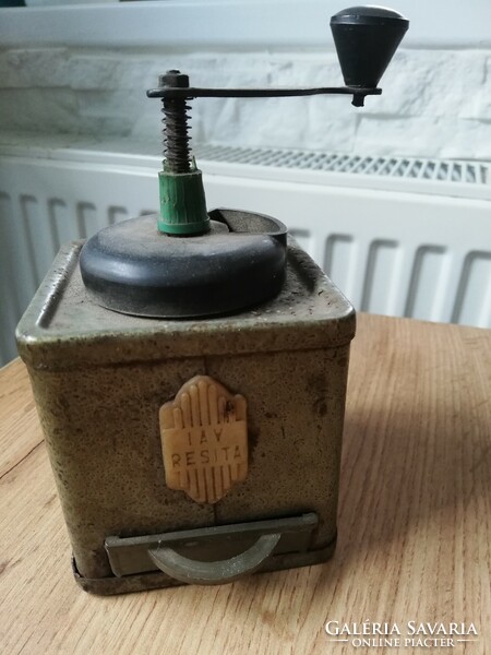 Old metal covered coffee grinder in mint condition