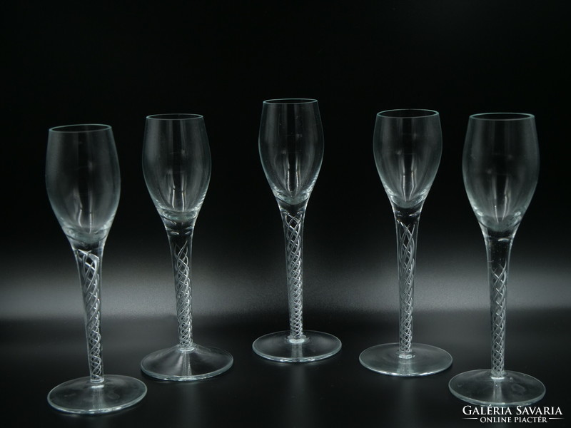 5 glass stemmed glasses with a body with twisted decoration