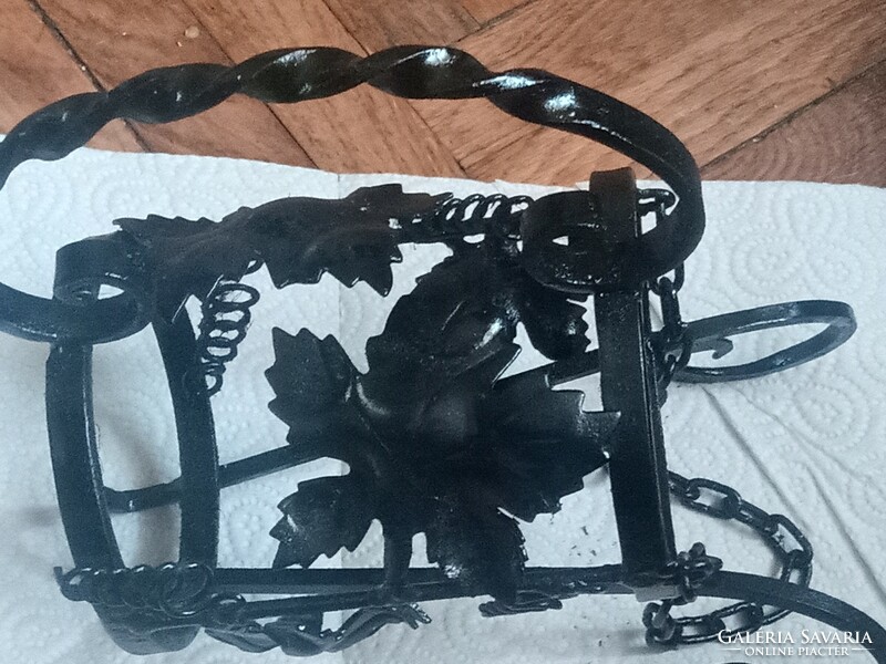 Richly decorated wrought iron wine rack for 1 bottle