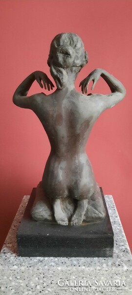 Kneeling female nude bronze statue