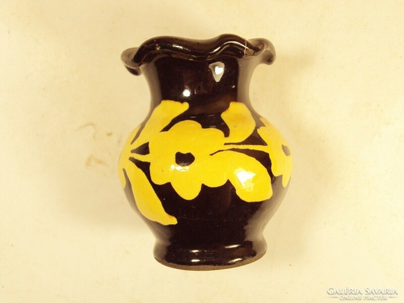 Old retro ceramic vase painted with a flower pattern