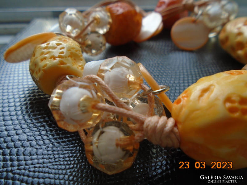 Unique handmade necklace of carved bone, polished seashell and clustered acrylic beads