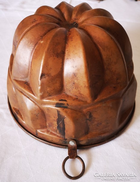 Old red copper kuglóf oven form, decoration in collection, kitchen confectionery