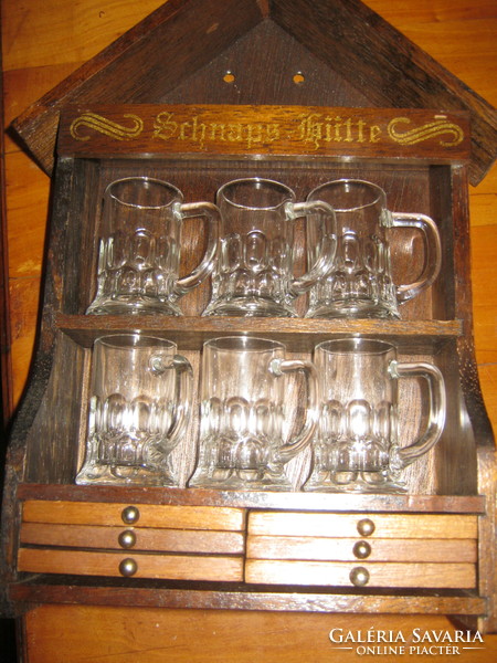 Schnapps set in a cottage with a glass coaster