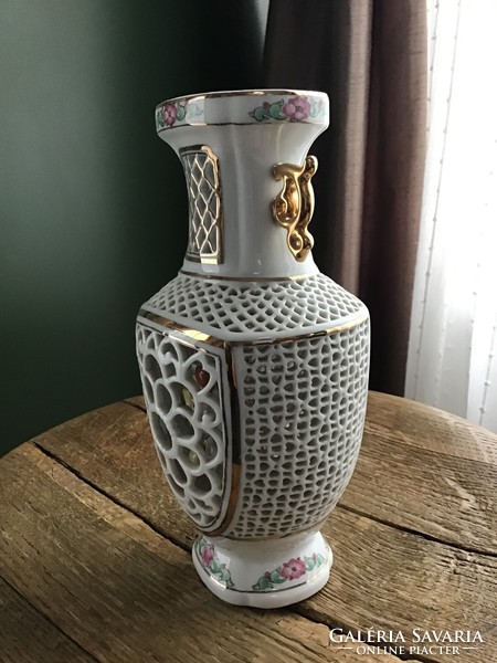Old Chinese openwork porcelain vase with an interior scene