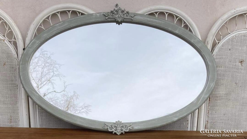 Large oval mirror, with carvings, can be used lying down or standing up,