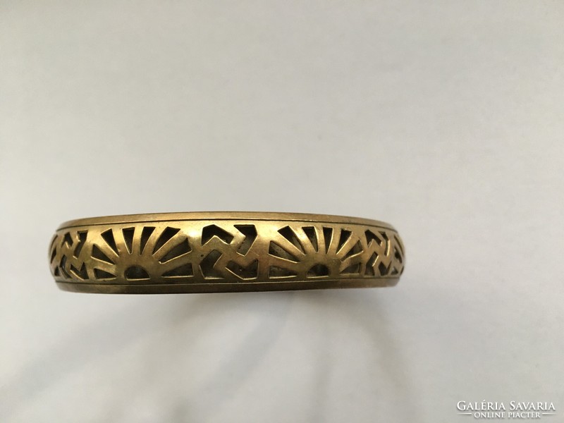 Filigree openwork copper bracelet with swastika symbol