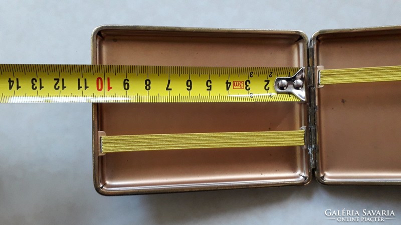 Old female metal cigarette case with vintage cigarette box
